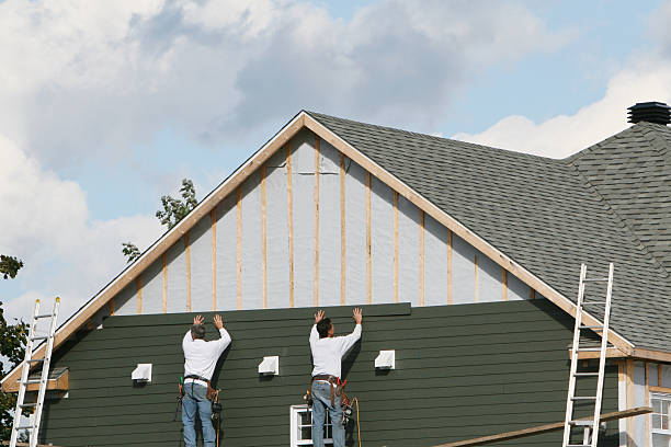 Professional Storm Damage Siding Repair technician working in Exmore, VA